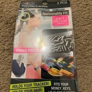 Brand New Scunci 2 in 1 hair + wrist band.